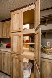 utility closet leading to master bathroom